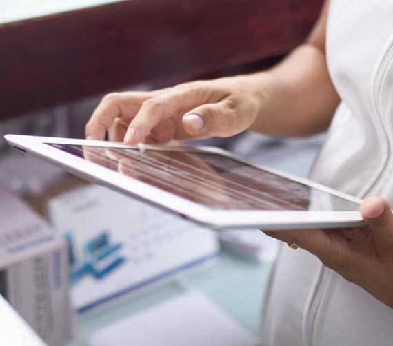 Image of nurse holding a tablet device Image of nurse holding a tablet device