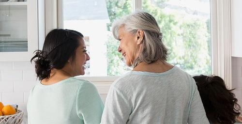 Mother and daughter smiling at each other